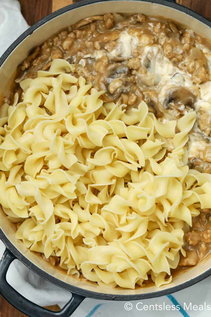 Sauce and noodles in a pot for creamy beef mushroom stroganoff