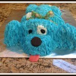 blue puppy cake on a tin foil sheet