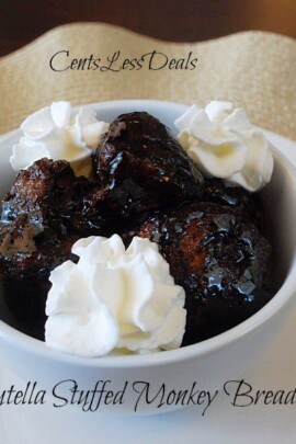 nutella stuffed monkey bread in a bowl with whipped cream