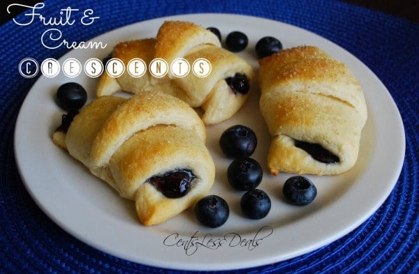 Fruit & Cream Crescents recipe on a plate with blueberries and a title