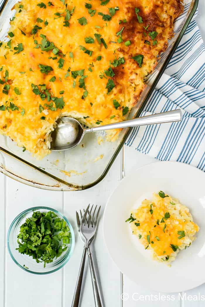 Hashbrown casserole in a casserole dish and on a plate with parsley