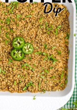 Jalapeno popper dip in a white casserole dish with a title