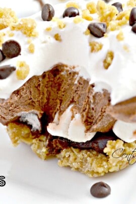 frozen s'mores bar on a white plate with a bite taken out and a title