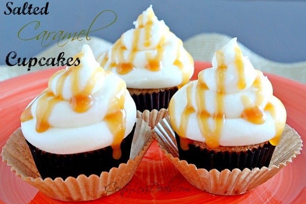 salted caramel cupcakes on a plate with caramel drizzled on and a title