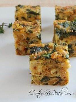 spinach and cheese bars on a white plate garnished with thyme