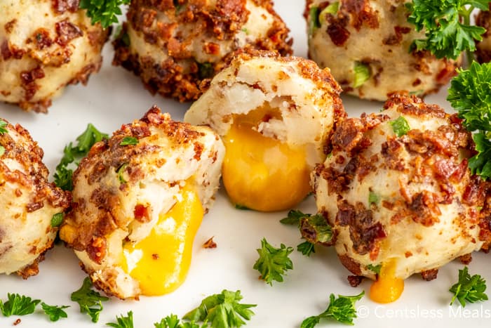 Mashed potato balls on a plate with parsley