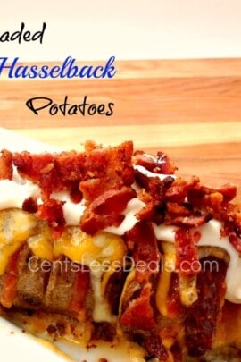 loaded hassleback potatoes on a white plate with bacon and a title