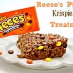reese's pieces rice krispie treats on a white plate with writing