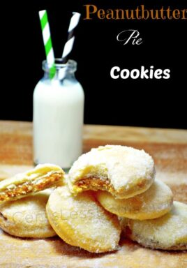 peanut butter pie cookies on a wooden board with milk in the background and a title