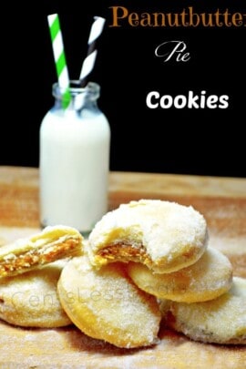 peanut butter pie cookies on a wooden board with milk in the background and a title