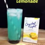 Blue raspberry spiked lemonade in a glass with Crystal Light and slices of lemonade