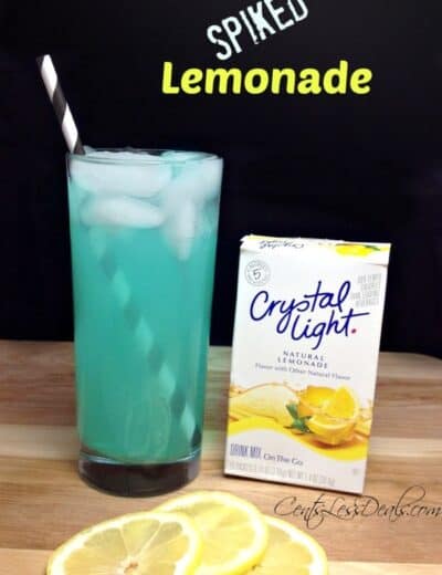 Blue raspberry spiked lemonade in a glass with Crystal Light and slices of lemonade