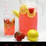 Moscato strawberry lemonade in a glass and in a glass pitcher with strawberries and lemon on the side