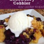 Three ingredient Blueberry cobbler slow cooker recipe on a white plate topped with ice cream with a title