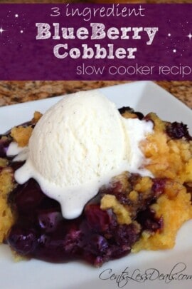 Three ingredient Blueberry cobbler slow cooker recipe on a white plate topped with ice cream with a title