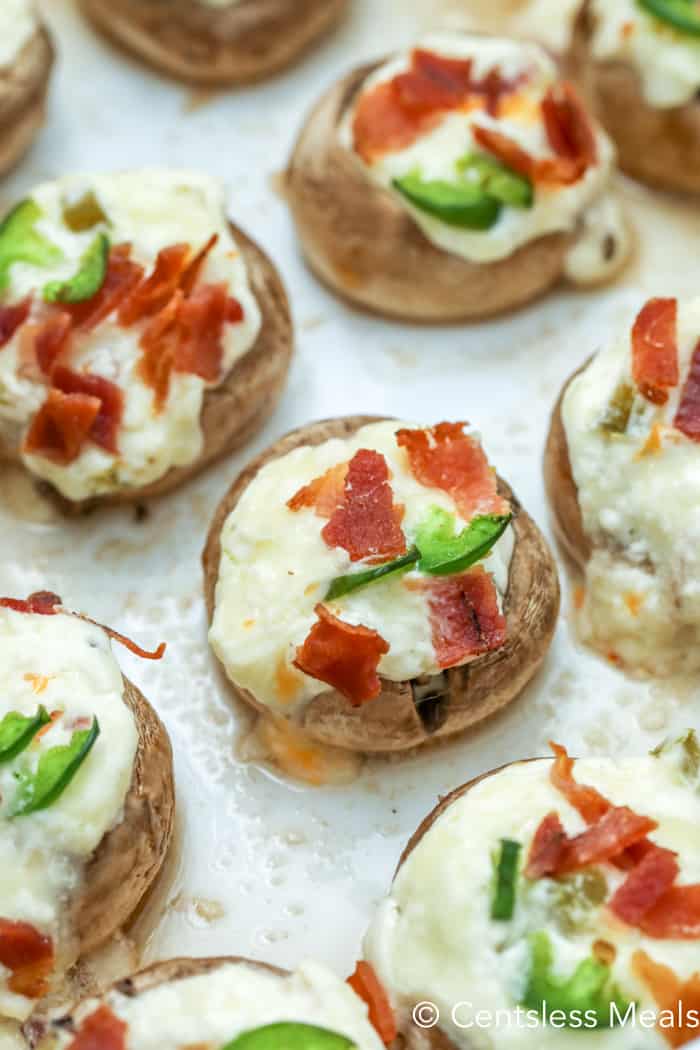 Jalapeno popper and bacon stuffed mushrooms in a dish