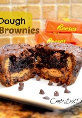 Reese's cookie dough brownie on a white plate cut in half to show the inside with Reese's peanut butter cups in the background and a title
