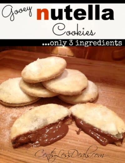 Gooey Nutella cookies on a wooden board with one cut in half to show the inside