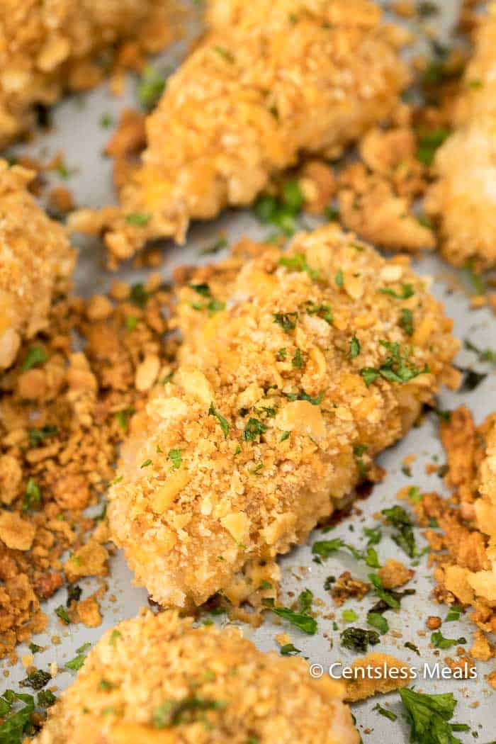 Ritz cracker chicken on a sheet pan with parsley