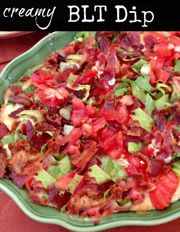 BLT dip in a green bowl with lettuce bacon tomatoes and green onion with a title