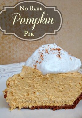 Cream cheese pumpkin pie on a white plate with whipped cream and writing