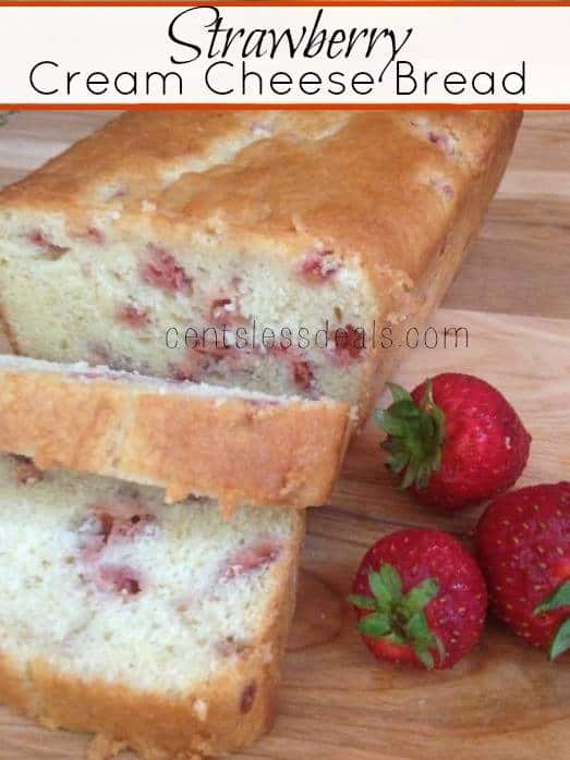 Strawberry cream cheese bread on a wooden board with strawberries and a title