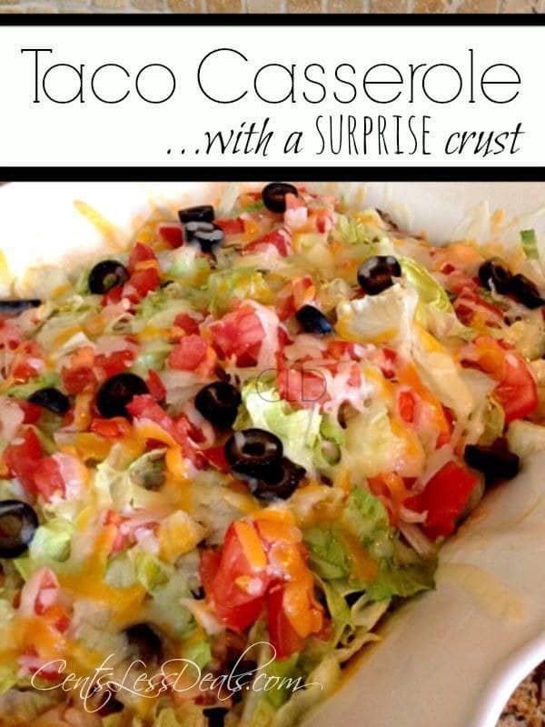 Taco casserole in a dish with lettuce tomato black olives and cheese and a title