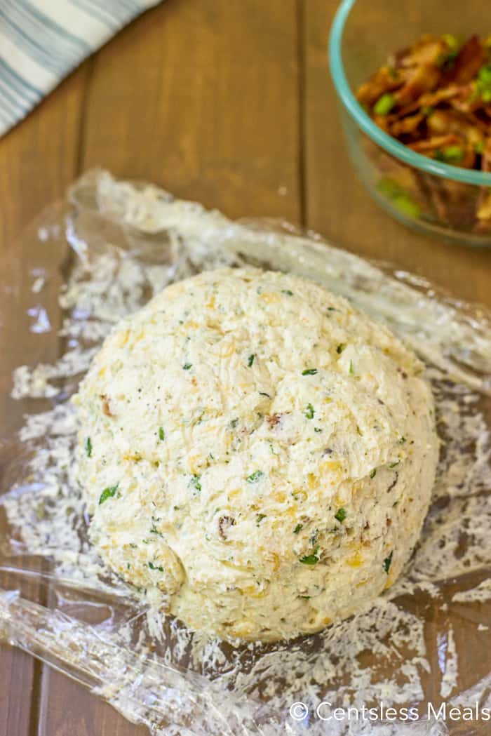prepping Bacon Ranch Cheeseball by wrapping in plastic wrap