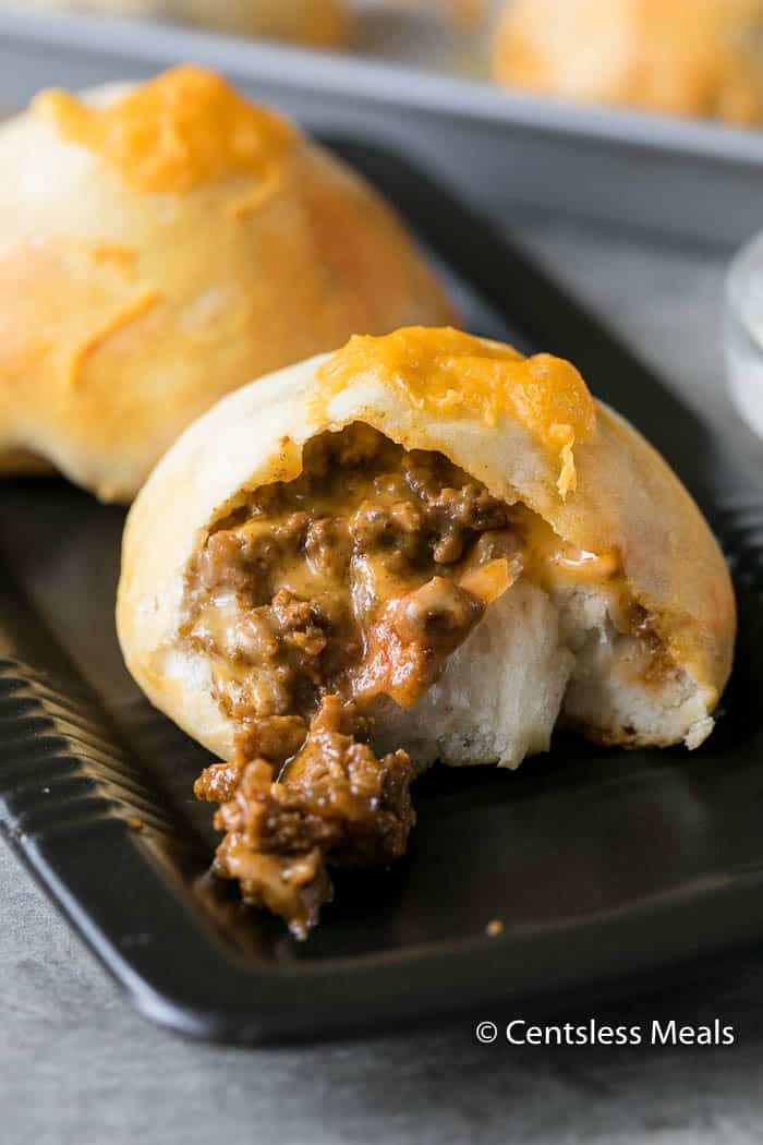 Biscuit taco pocket on a plate with the inside mixture oozing out