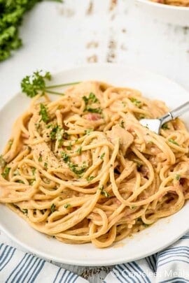 overhead of Chicken Spaghetti on a plate with a fork