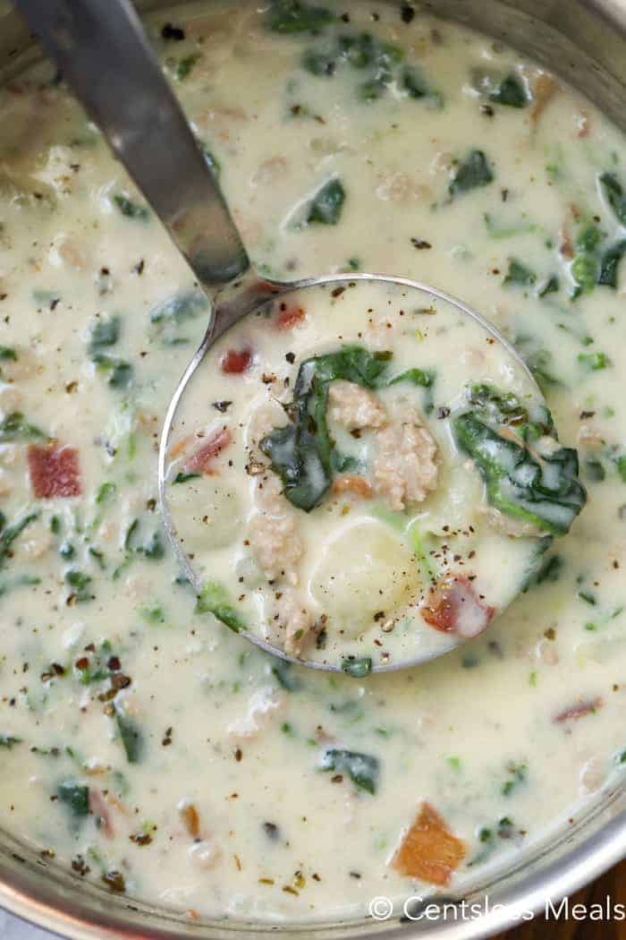 Zuppa Toscana in a pot with a ladle