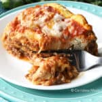 Cheesy Crock-Pot lasagna on a plate with a fork