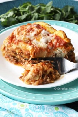 Cheesy Crock-Pot lasagna on a plate with a fork