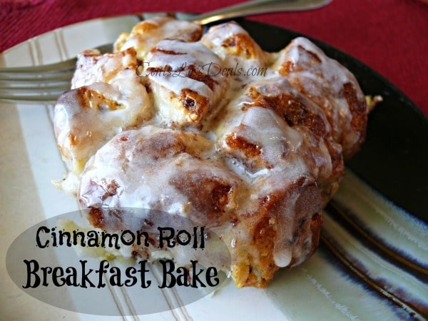 Piece of cinnamon roll on a plate with a fork and a title