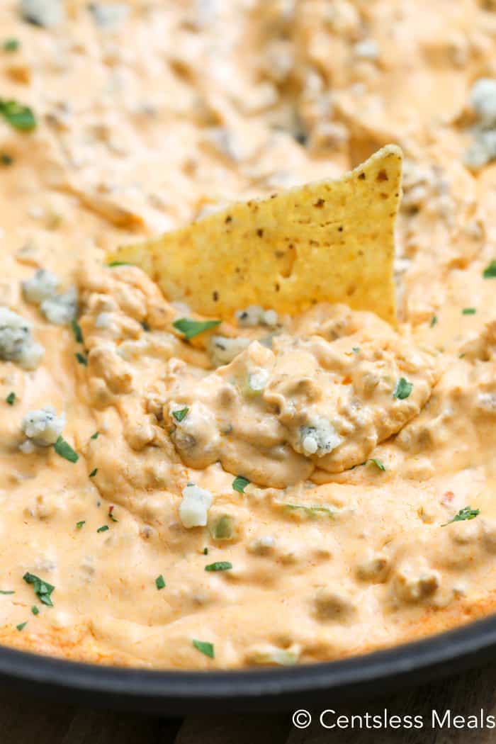 Buffalo sausage dip with a tortilla chip