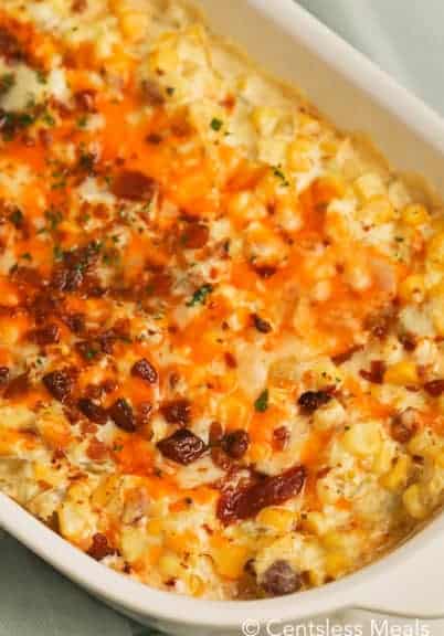 Corn casserole in a white casserole dish