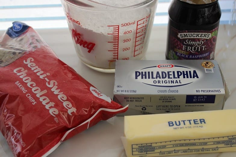 Ingredients for black raspberry chocolate chip cheese ball on the countertop