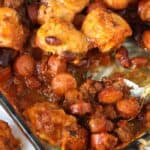 Chili cheese dog bake in a casserole dish with a spoon