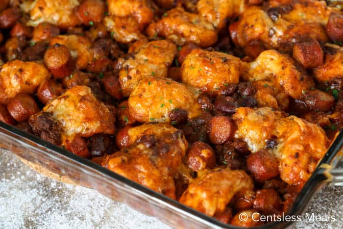 Chili cheese dog bake in a clear casserole dish