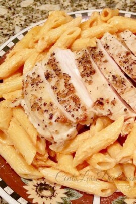 Tomato Cream Sauce Pasta with Grilled Chicken on a plate