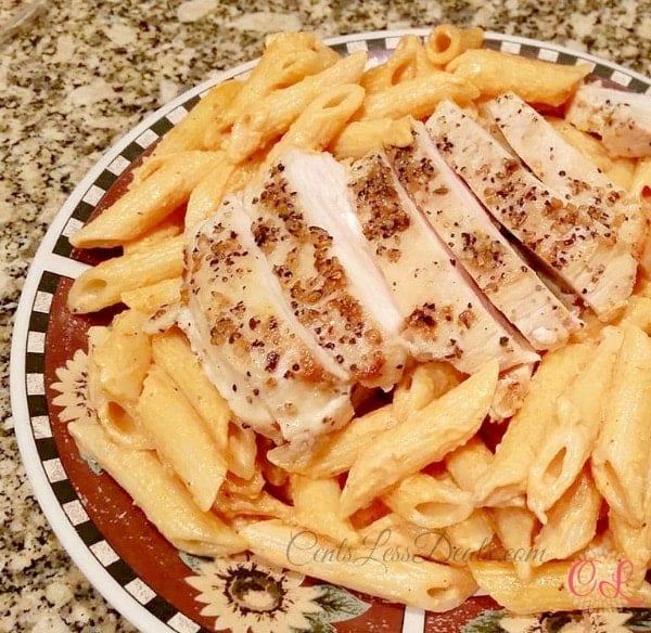 Tomato Cream Sauce Pasta with Grilled Chicken on a plate