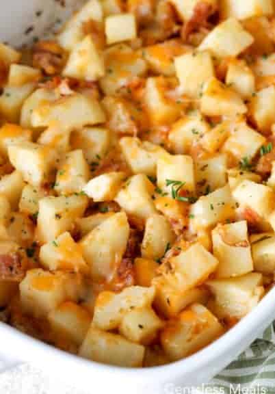 Cheesy Ranch potatoes with bacon in a white casserole dish