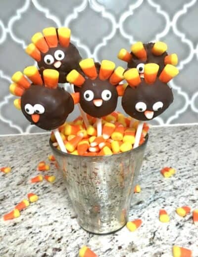 Thanksgiving turkey Pops in a dish with candy corn