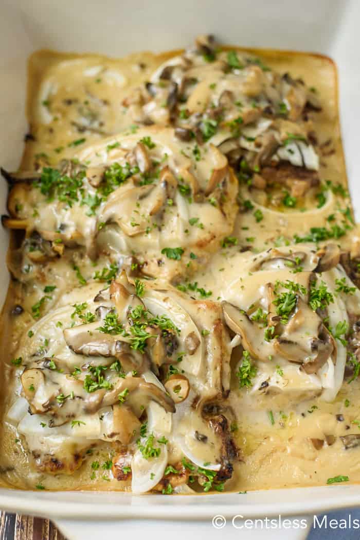 overhead of baked casserole dish of Pork Chops with Mushroom Gravy