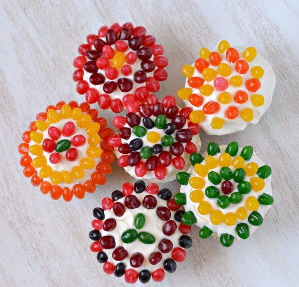 Jelly bean flour cupcakes on a wooden board