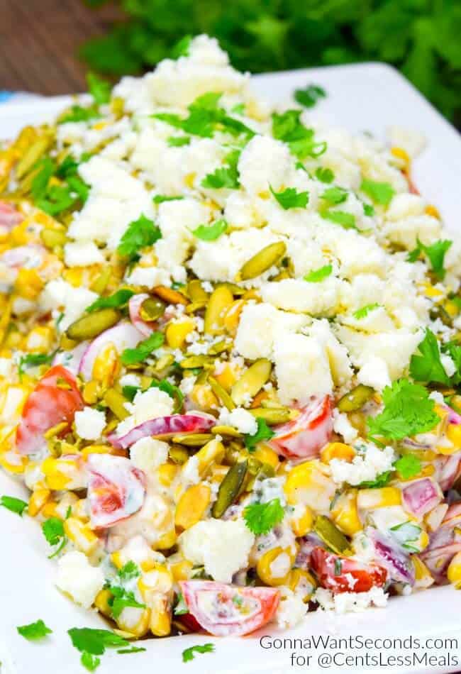 Mexican Corn Salad garnished with cilantro and cheese