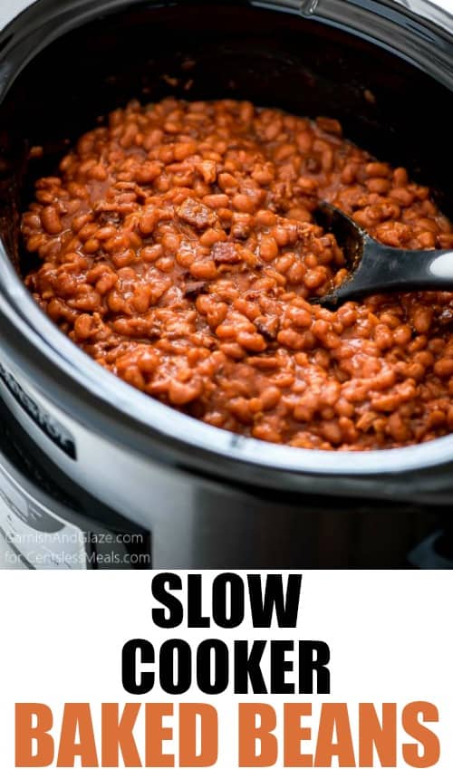 Slow cooker baked beans in a slow cooker with a spoon and a title