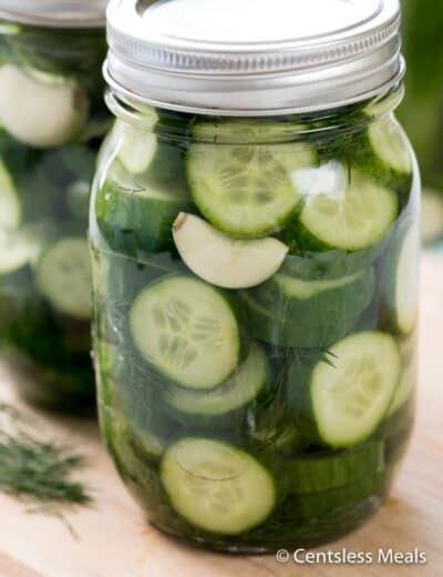 Refrigerator Dill Pickles in a mason jar on a wooden board