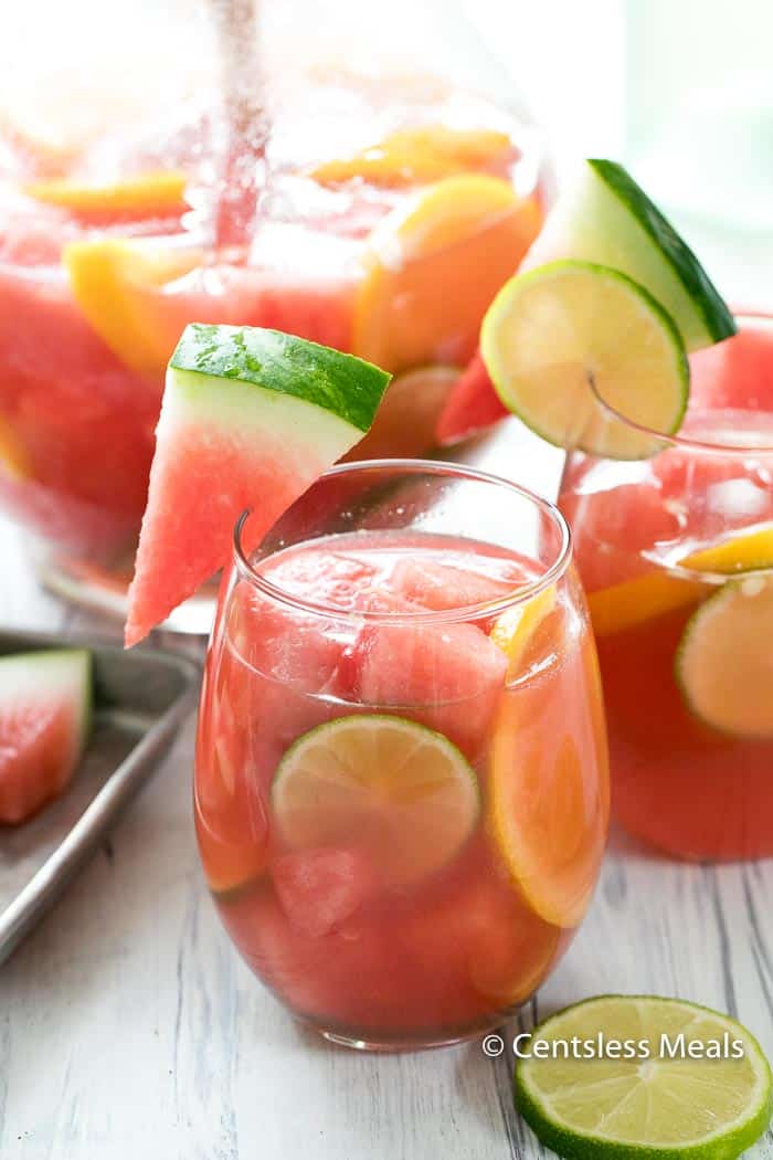 Watermelon sangria in glasses garnished with lime and watermelon
