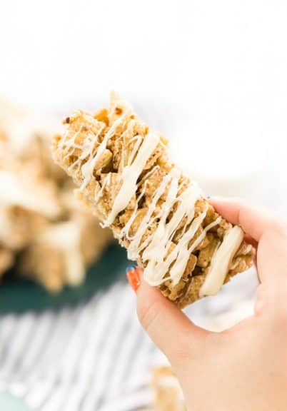 A brown butter pecan cereal bar being held